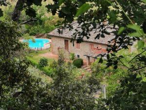 an external view of a house with a swimming pool at Casa Caterina in Moncioni
