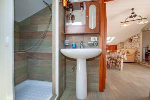 a bathroom with a sink and a shower at Villa del Papiro Charme Apartments in Avola