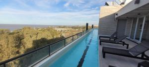 a swimming pool on the balcony of a house at Monoambiente c/vista al río-pax3 in Olivos