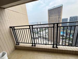 a bathroom balcony with a view of a city at Guangzhou Phantom Oasis Apartments - Canton Fair Exhibition Area in Guangzhou