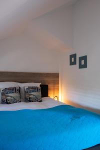 Letto o letti in una camera di B&B De Joker