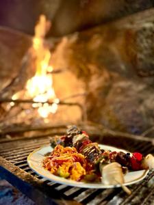 a plate of food on a table in an oven at Establecimiento La Soleada suites de campo in La Cumbre