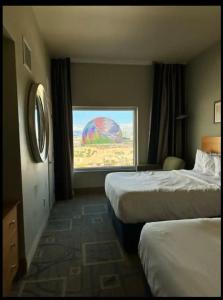 a hotel room with two beds and a window at Apartment with Balcony at Platinum Hotel in Las Vegas