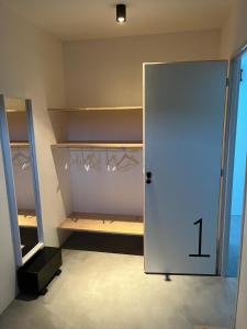 a closet with a white door with the number one on it at Villa Casa Papey in Draguignan