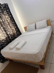 Postel nebo postele na pokoji v ubytování Gianna’s Stays