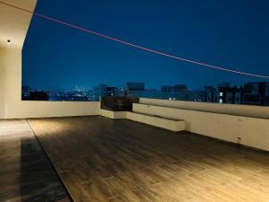 an empty room with a view of a city skyline at Ultra luxury 5BHK duplex in Kondapur in Kondapur