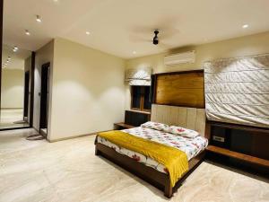 a bedroom with a large bed in a room at Ultra luxury 5BHK duplex in Kondapur in Kondapur