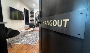 a room with a door with the word hangout on it at Stay At Jimmy's in Woodstock