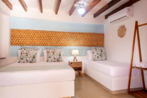 Postel nebo postele na pokoji v ubytování Hotel Isla del Sol