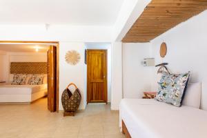 Postel nebo postele na pokoji v ubytování Hotel Isla del Sol