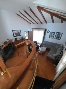 a view of a living room with a wooden staircase at Apartment Monvidal in Pula