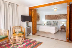 Postel nebo postele na pokoji v ubytování Hotel Isla del Sol