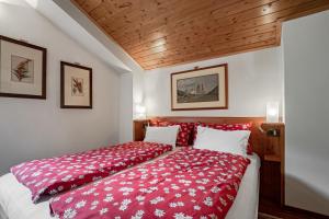 Voodi või voodid majutusasutuse Chalet Pradat toas