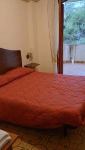 Ein Bett oder Betten in einem Zimmer der Unterkunft Holiday Home Recanati