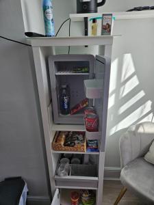 an open refrigerator with food inside of it at Prime Location Room Stay in Northampton
