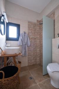 a bathroom with a sink and a toilet at Blue Crystal View in Kavála