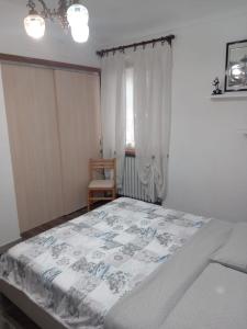 Ein Bett oder Betten in einem Zimmer der Unterkunft La tana di Pisolo
