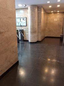 a lobby with a tile floor and pillars in a building at Coração do Rio de Janeiro in Rio de Janeiro