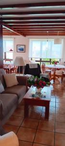 a living room with couches and a table at Prau del Urogallo in Ribadesella +44 photos
