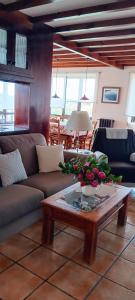 a living room with a couch and a coffee table at Prau del Urogallo in Ribadesella