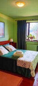 a bedroom with a bed and a window at Prau del Urogallo in Ribadesella