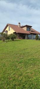a large house with a large green field in front of it at Prau del Urogallo in Ribadesella