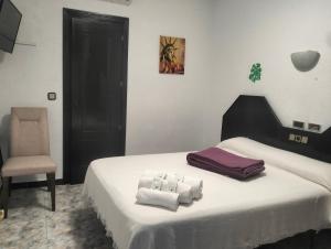 A bed or beds in a room at Hostal New York City