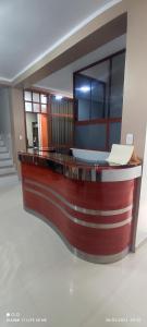 a reception desk in a room with a counter at casa sol residencial tarapoto in Tarapoto
