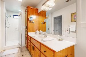 a bathroom with a sink and a shower at Casa Austin in Fredericksburg