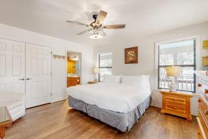 a bedroom with a bed and a ceiling fan at Casa Austin in Fredericksburg