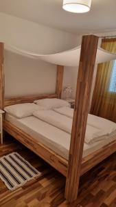 a bedroom with two bunk beds with white sheets at Casa Emma in Poreč