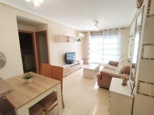 TV a/nebo společenská místnost v ubytování Edificio Costa Azahar II