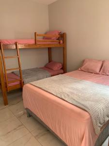 a room with two beds and two bunk beds at Casa villa Gravatá in Gravatá +41 photos
