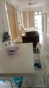 a white table and chairs in a living room at Homestay Taman Tiara Paka Full AC Free Wi-fi & COWAY in Paka