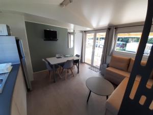 a small living room with a couch and a table at litteau 213 in Litteau