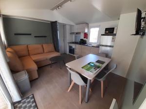 a small apartment with a table and a couch at litteau 213 in Litteau