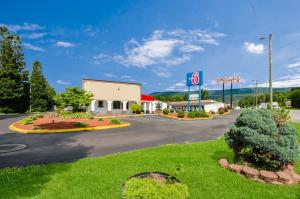 a sign for a gas station in a parking lot at Motel 6-Salem, VA in Salem