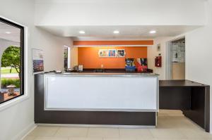 a lobby with a large white counter in a building at Motel 6-Salem, VA in Salem