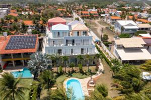 an aerial view of a house with solar panels on its roof at Apartamento beira-mar em Carneiros in Tamandaré