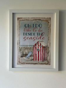 a picture of a framed picture of a house at Annie's Hideaway in Chapel Saint Leonards