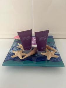 a tray with two cups and cookies on it at Annie's Hideaway in Chapel Saint Leonards