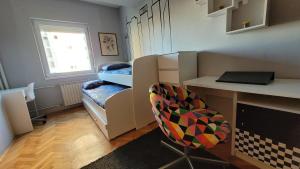 a small room with a desk and a chair at Soleil Central Apartments in Skopje