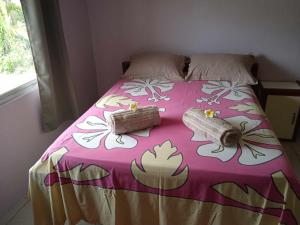 a bed with two boxes on top of it at Chez Angele in Faie