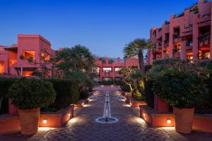 a courtyard with a fountain in the middle of a building at The Ritz-Carlton Tenerife, Abama in Guía de Isora