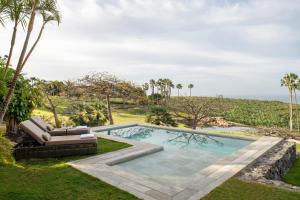 an image of a swimming pool in a yard at The Ritz-Carlton Tenerife, Abama in Guía de Isora