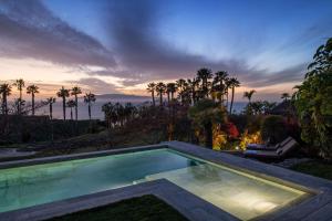 a swimming pool in the yard of a house at The Ritz-Carlton Tenerife, Abama in Guía de Isora