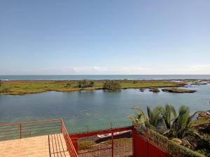 a view of a river with the ocean in the background at Hostal Apartamento con salida al mar in Puerto Limón