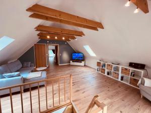 TV a/nebo společenská místnost v ubytování Ferienhaus Garz