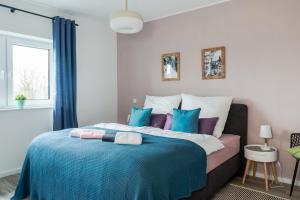 Ένα ή περισσότερα κρεβάτια σε δωμάτιο στο Schönes PENTHOUSE Dümmer See - Lembruch