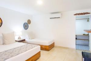 Postel nebo postele na pokoji v ubytování Hotel Isla del Sol